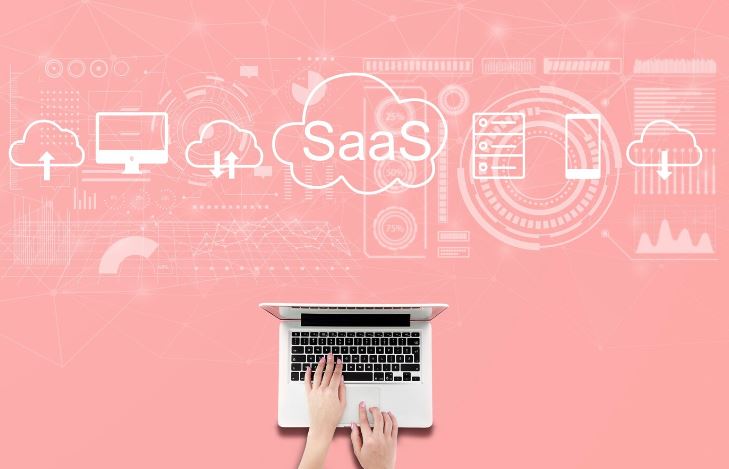 Product management concept with a laptop and cloud-based technology icons representing SaaS solutions for managing products.